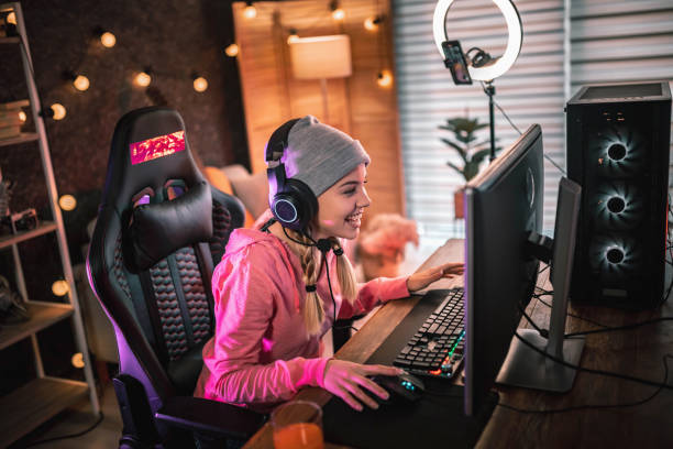 Girl plays video game online and streaming   at home